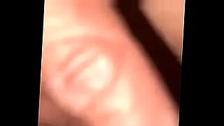 multiple women sucking one cock together in a club